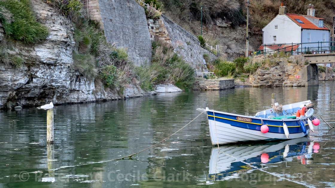 "Fishing Cobble moored in Staithes Beck." stock image