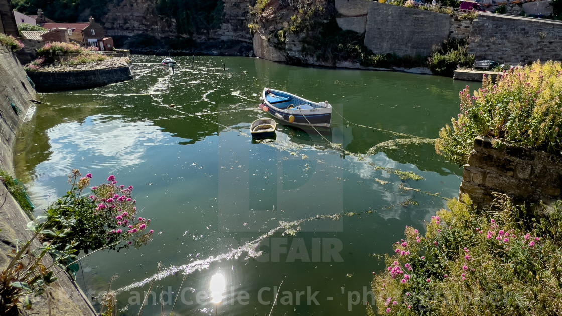 "Fishing CobbleS moored in Staithes Beck." stock image