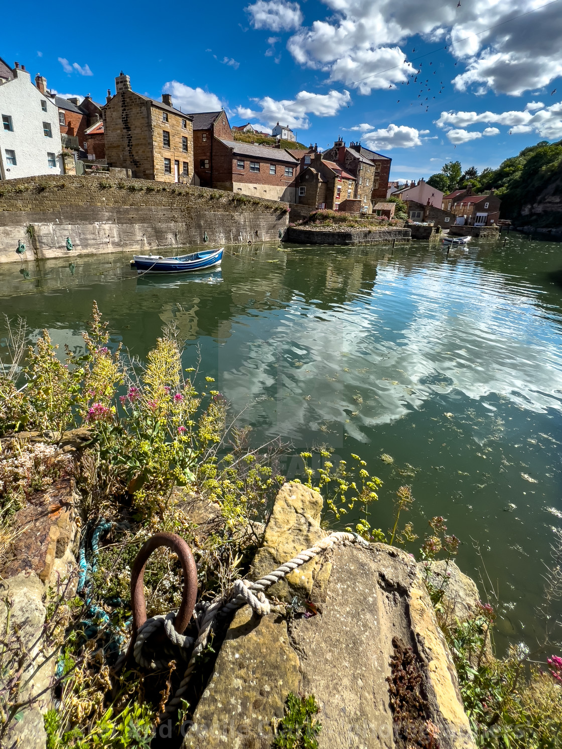 "Fishing Cobble moored in Staithes Beck." stock image