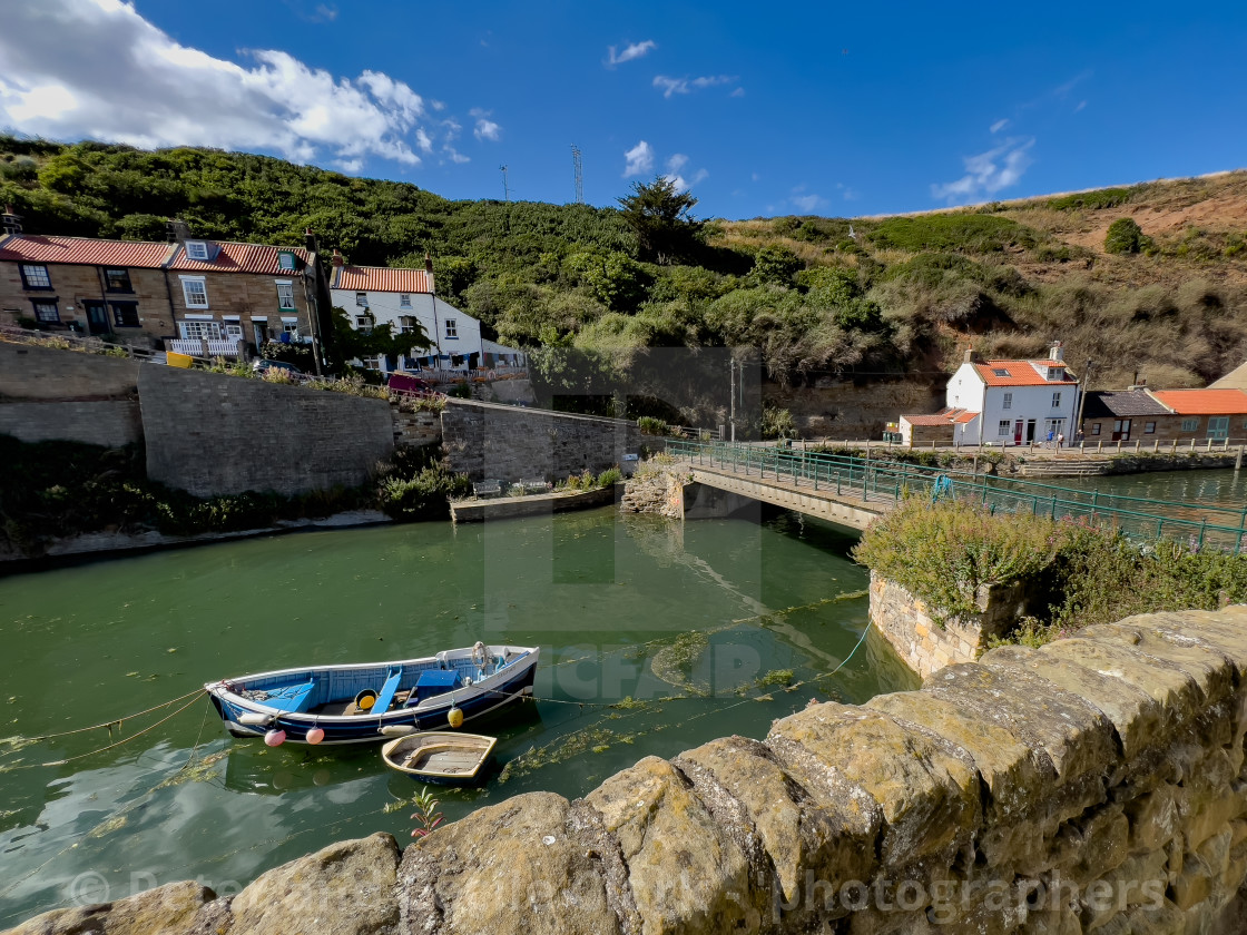 "Fishing Cobble moored in Staithes Beck." stock image