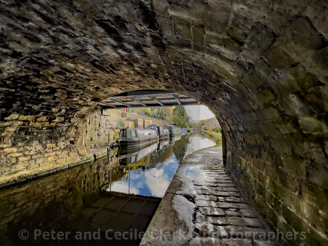 "Rochdale Canal Path under Bridge and Barge, Hebden Bridge." stock image