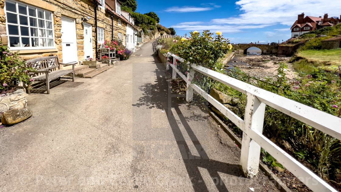 "Sandsend Cottages and Beck." stock image