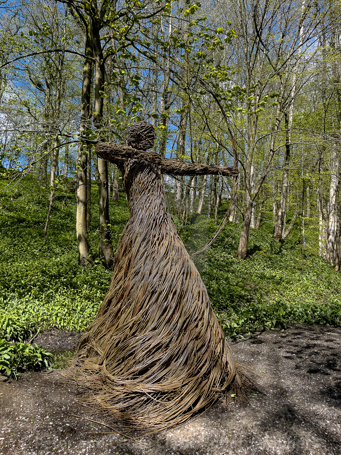 "Willow Sculpture of Woman Archer ‘Spirit of Medieval Huntress’. Located in Skipton Castle Woods, Skipton," stock image