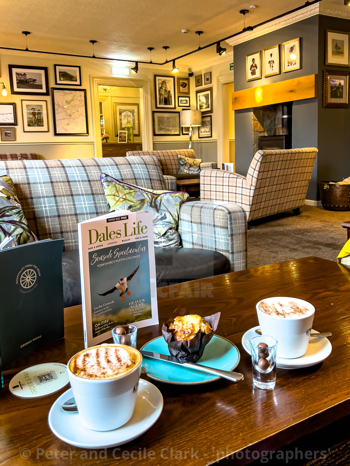 "Richmond, North Yorkshire, Kings Head Hotel Lounge relaxing with coffee" stock image