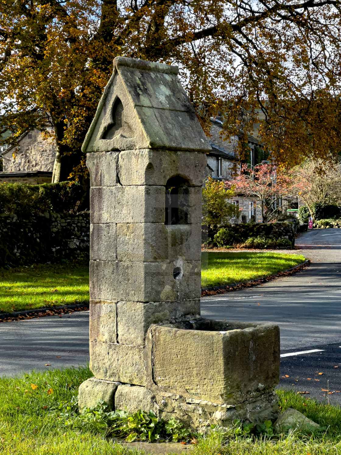 "Arncliffe Water Pump and Village Green" stock image