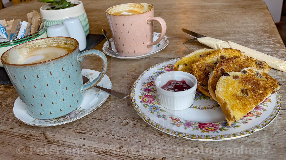 "Hot buttered toasted teacake with Jam and Coffee." stock image