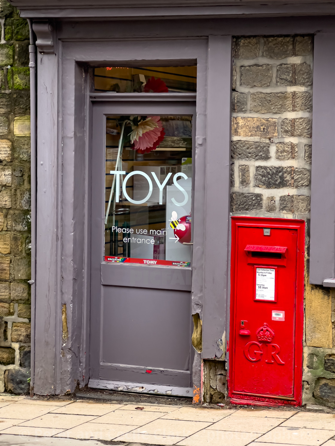 "Pateley Bridge, High Street Toy Shop and red postbox." stock image