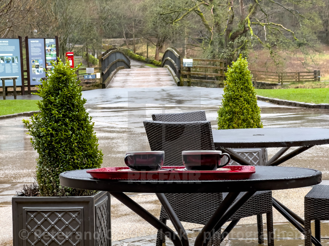 "Cavendish Pavilion, Bolton Abbey, Yorkshire Dales, England, UK. Outside seating and table with coffee cups. Photographed 1st March 2024" stock image