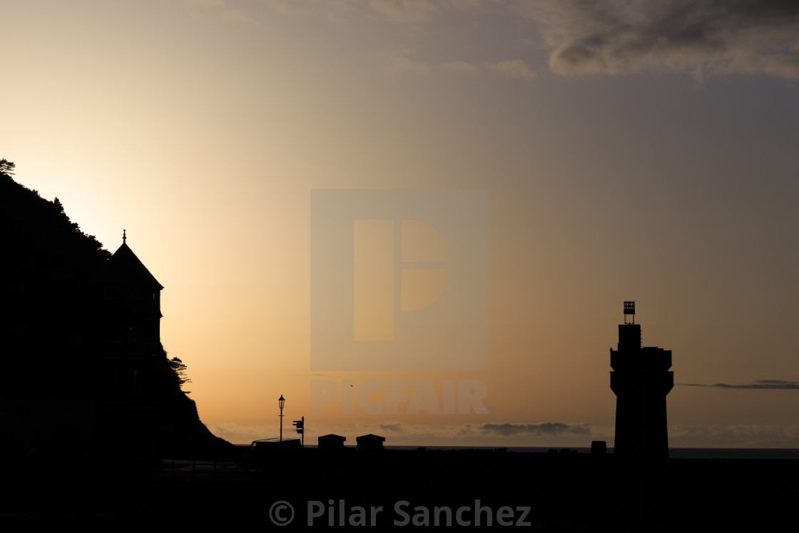 "Lynmouth harbour and Rhenish tower silhouette at sunset." stock image