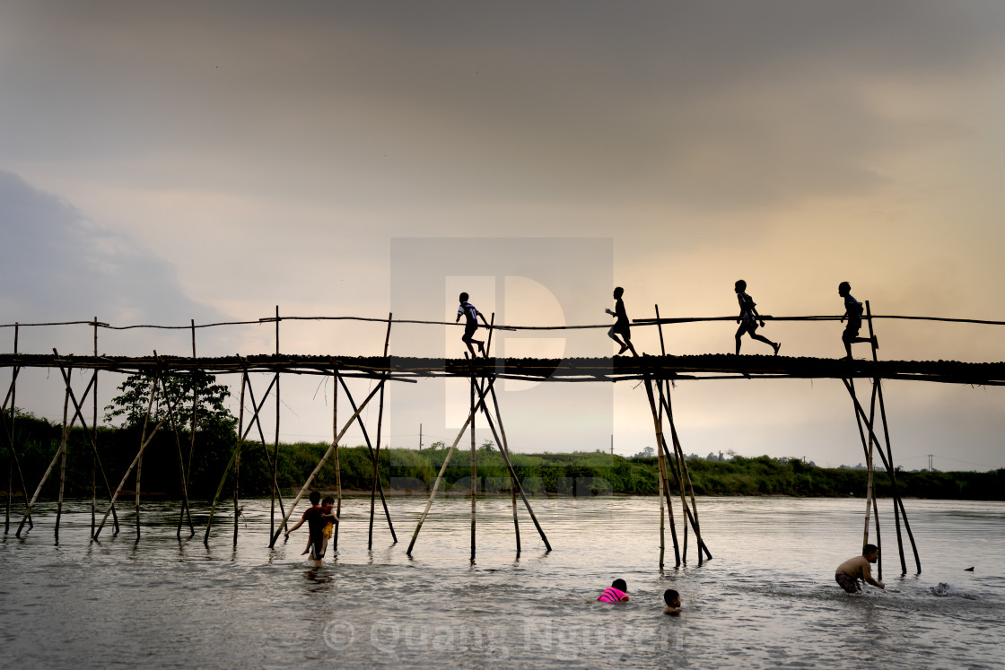 "Rural children on a bamboo bridge" by Quang Nguyen - $43.35 "Rural children on a bamboo bridge" stock image