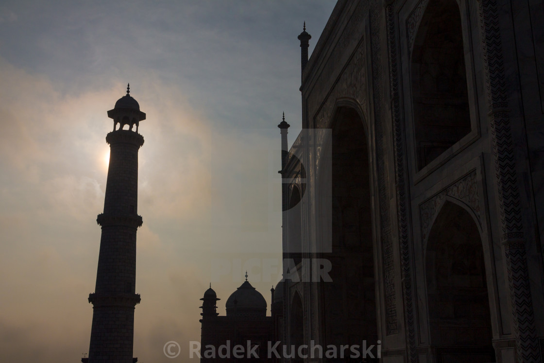 "Taj Mahal’s minaret backlit by the early morning sun" stock image