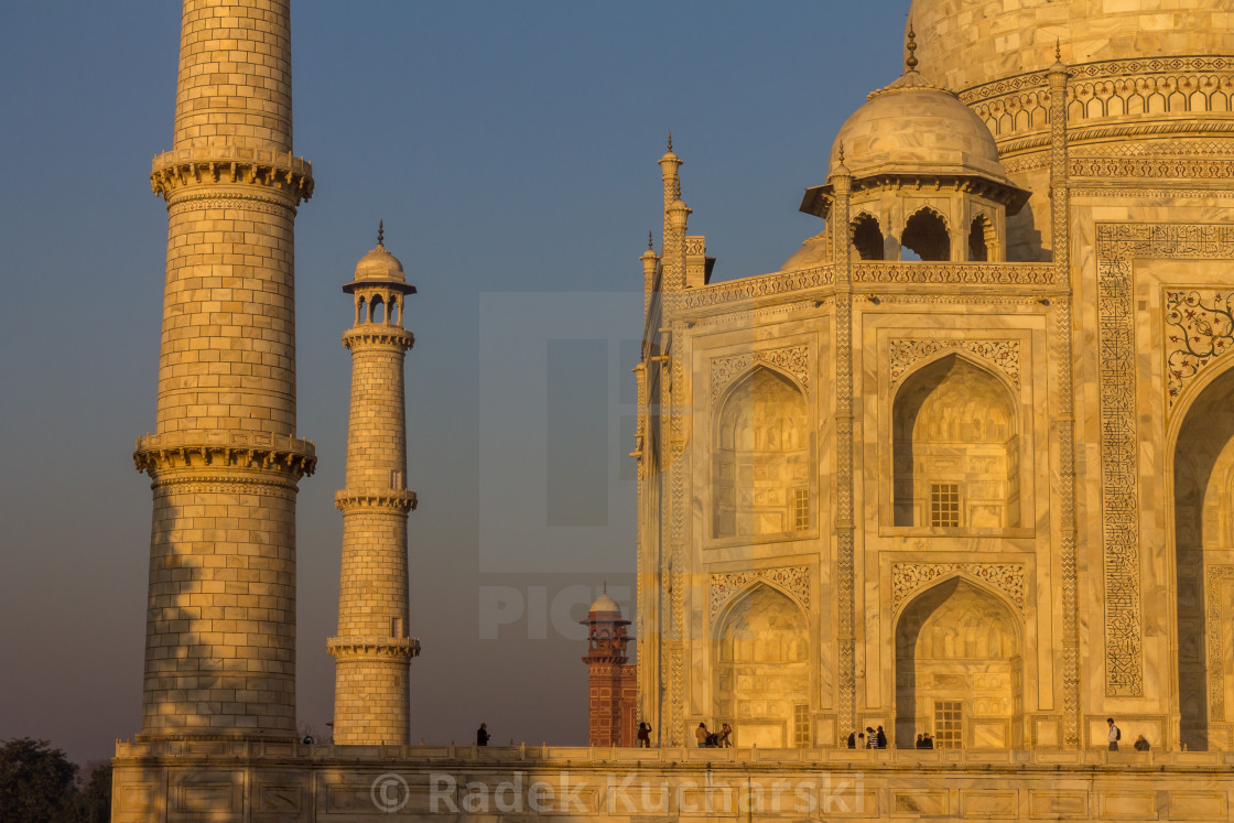 "Taj Mahal: minaret and a part of the façade in the golden rays" stock image