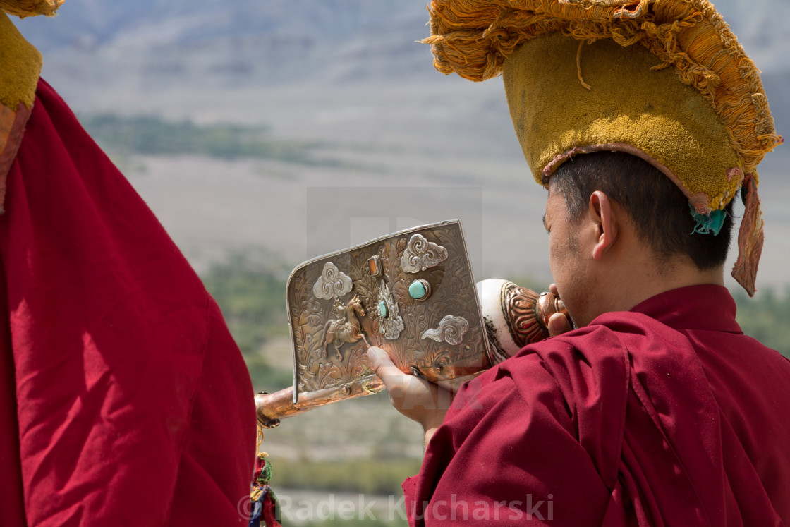 "Monk playing the Tibetan conch sell drum in Thikse Monastery" stock image