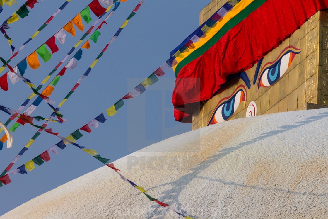 "Eyes of the Buddha or Wisdom Eyes on the golden spire of Boudhanath in Kathmandu" stock image