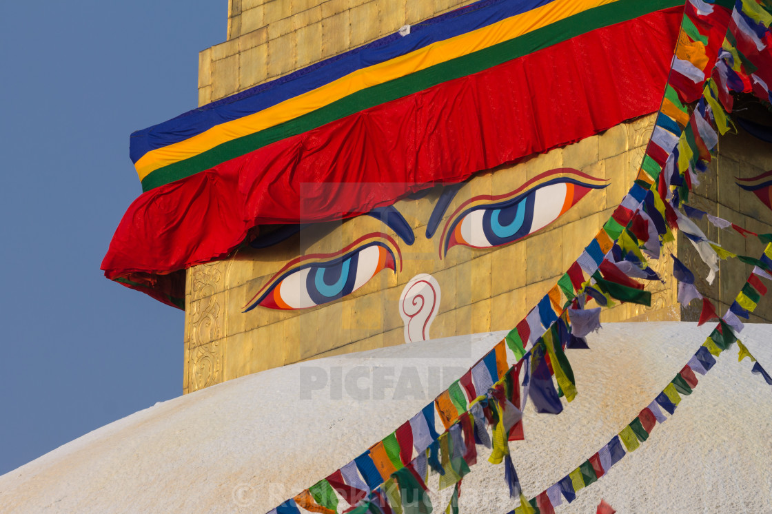 "Eyes of the Buddha or Wisdom Eyes on the golden spire of Boudhanath in Kathmandu" stock image