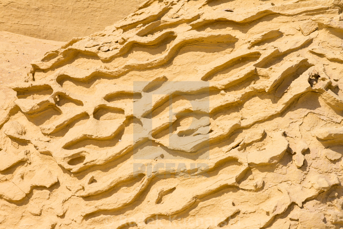 "Pattern on a sandstone boulder sculpted by wind erosion. Wadi al-Hitan in the Sahara desert, Egypt." stock image