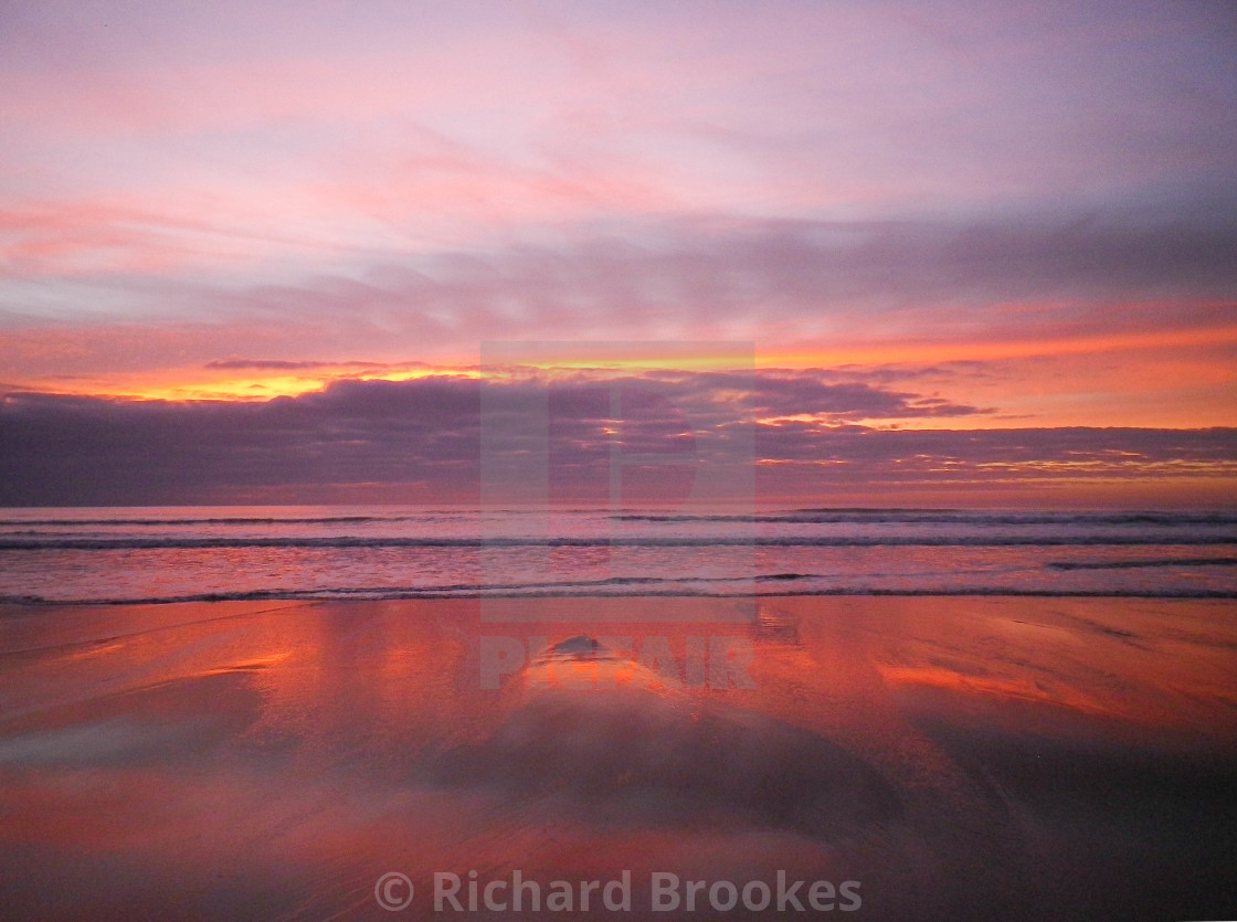 "PURPLE, PINK & ROSE GOLD SUNSET SANDYMOUTH BEACH CORNWALL" by Richard Brookes - $18.07 "PURPLE, PINK & ROSE GOLD SUNSET SANDYMOUTH BEACH CORNWALL" stock image