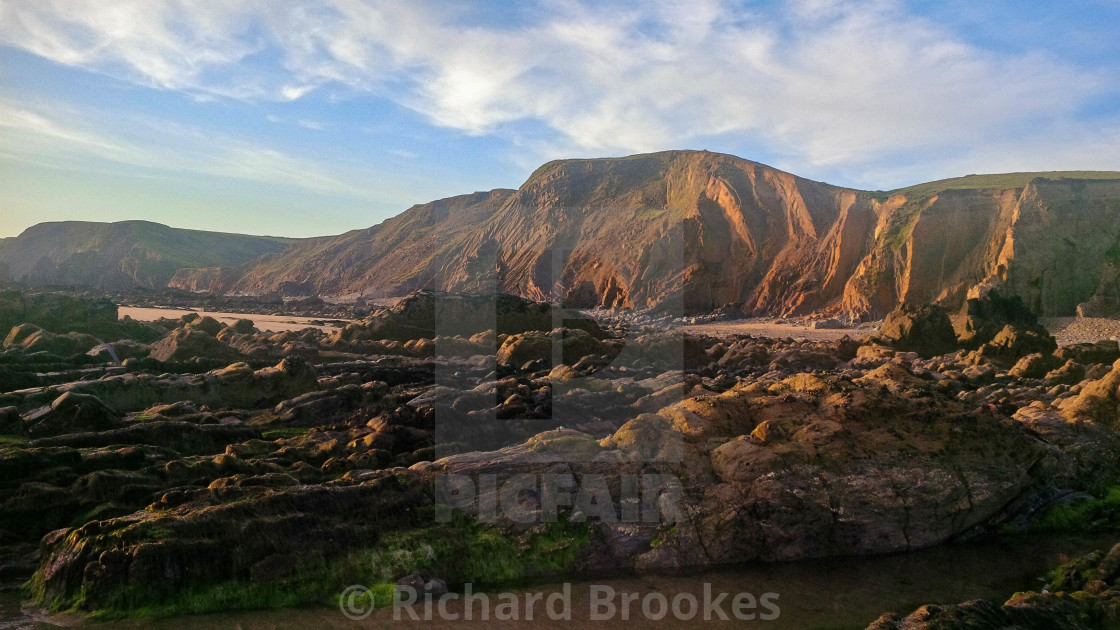 "SUMMER SOLSTICE SANDYMOUTH BEACH CORNWALL" by Richard Brookes - $18.08 "SUMMER SOLSTICE SANDYMOUTH BEACH CORNWALL" stock image