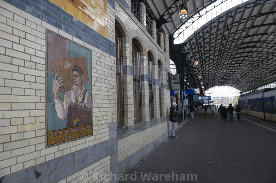 "Haarlem The Netherlands 28th March 2024 Art-deco decorative tiling at Haarlem station. To celebrate the centenary of the Dutch railway porters. Tegeltableu, tiles, tile, eeuwfeest, kruiers, statio" stock image