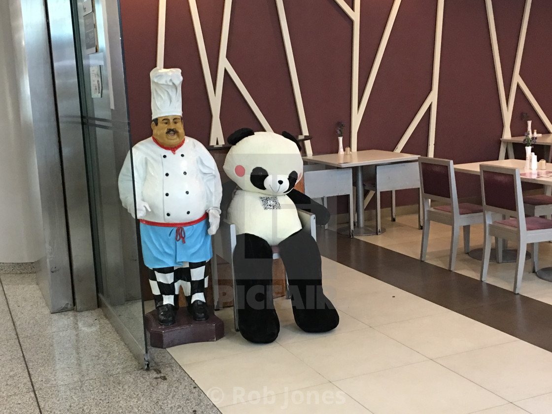 "Chef and Panda at a restaurant at Beijing International Airport" stock image