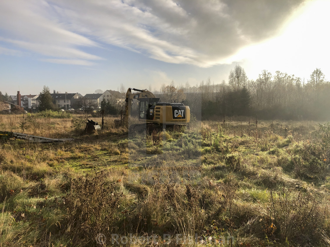 "excavator on a construction plot" stock image