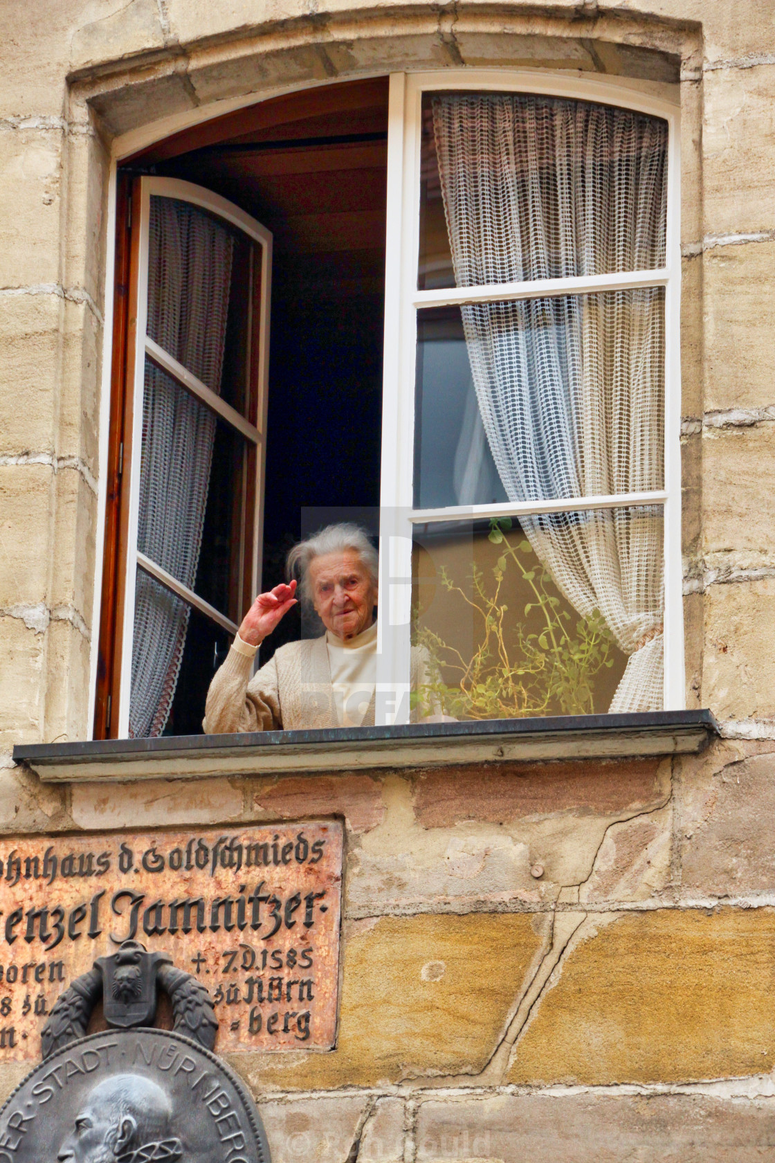 "Woman in a window." stock image