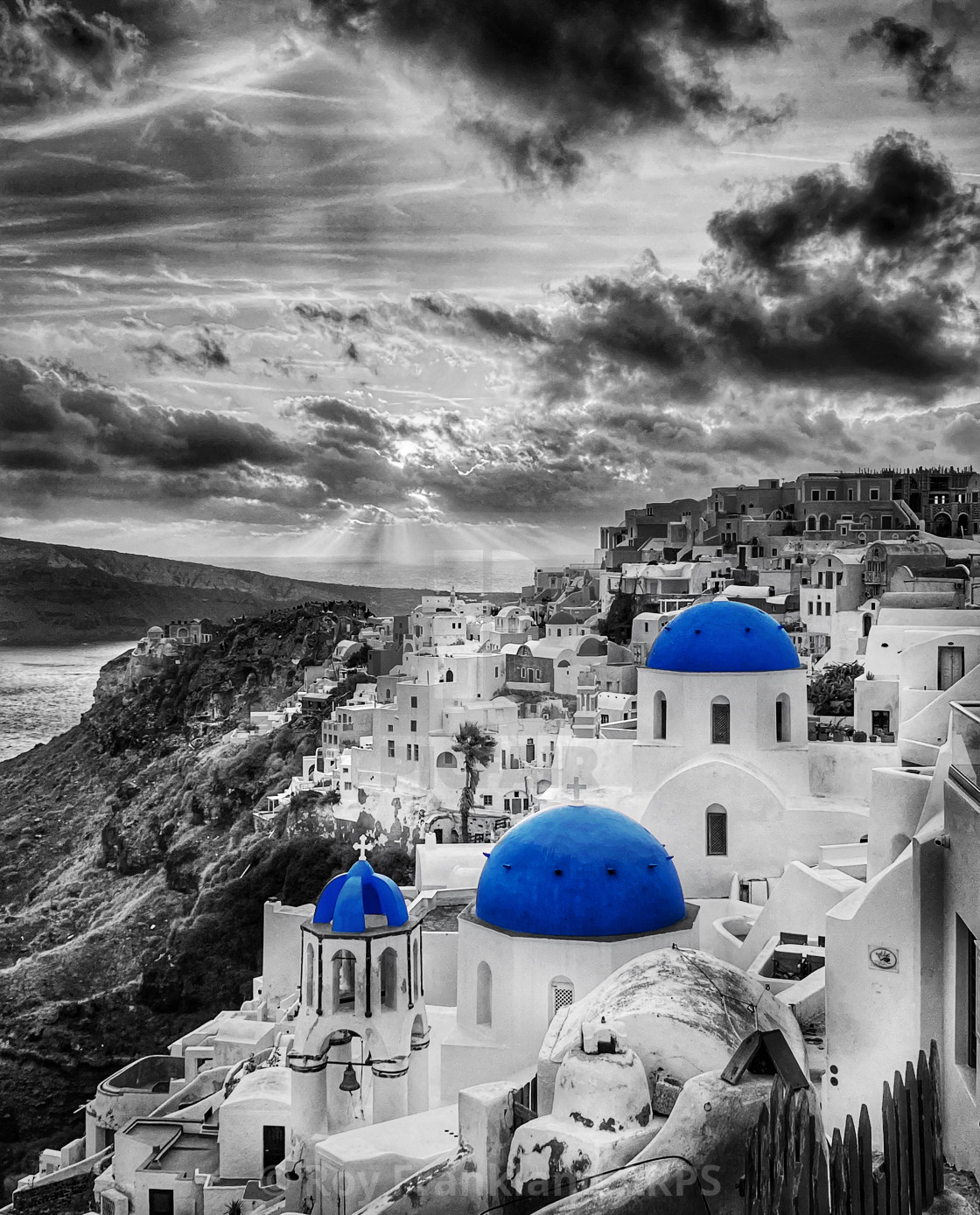 "Sunset over Oia, Santorini, selectively coloured" stock image