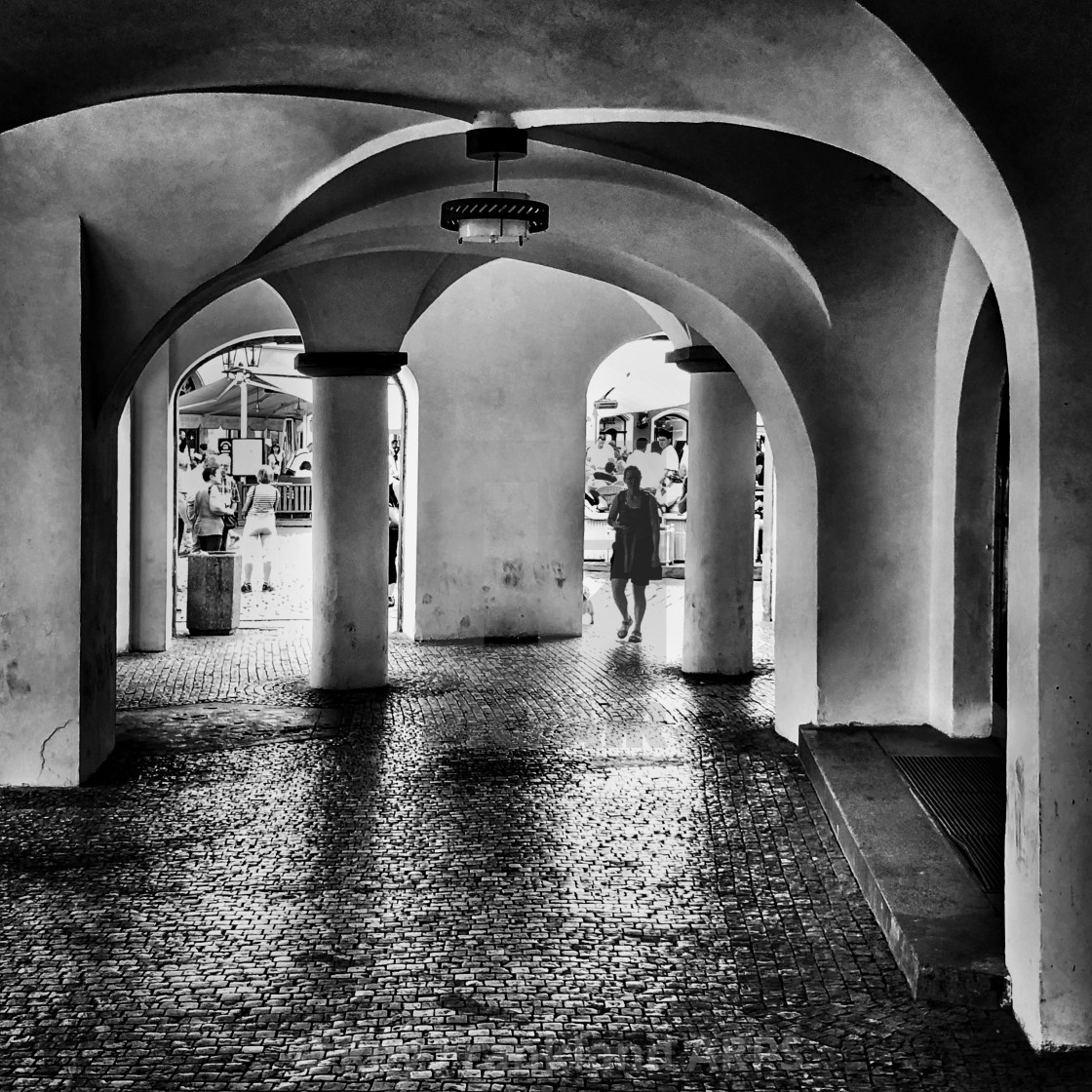 "Figure under the arches, mono" stock image