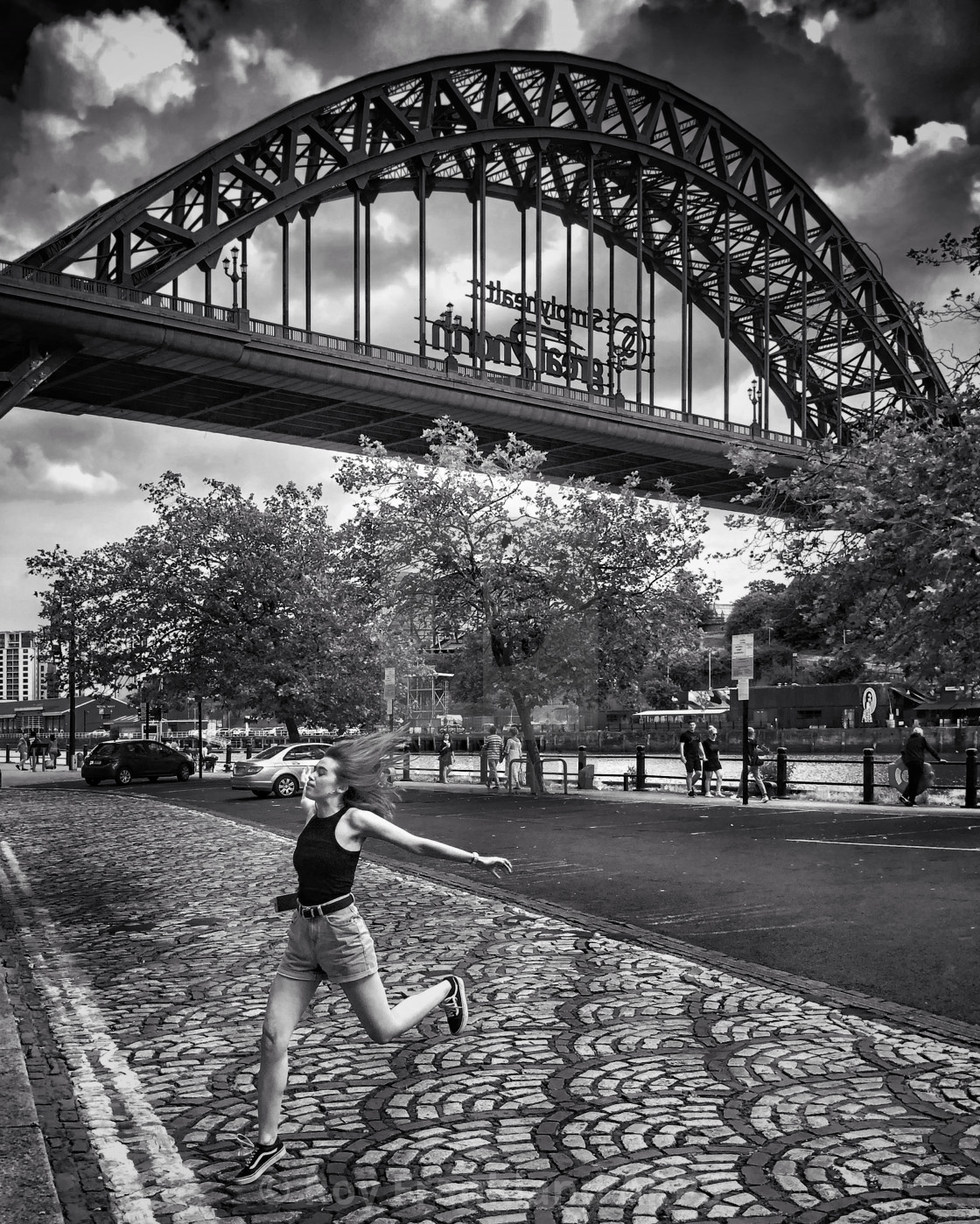 "Girl Jumping on the quayside" stock image