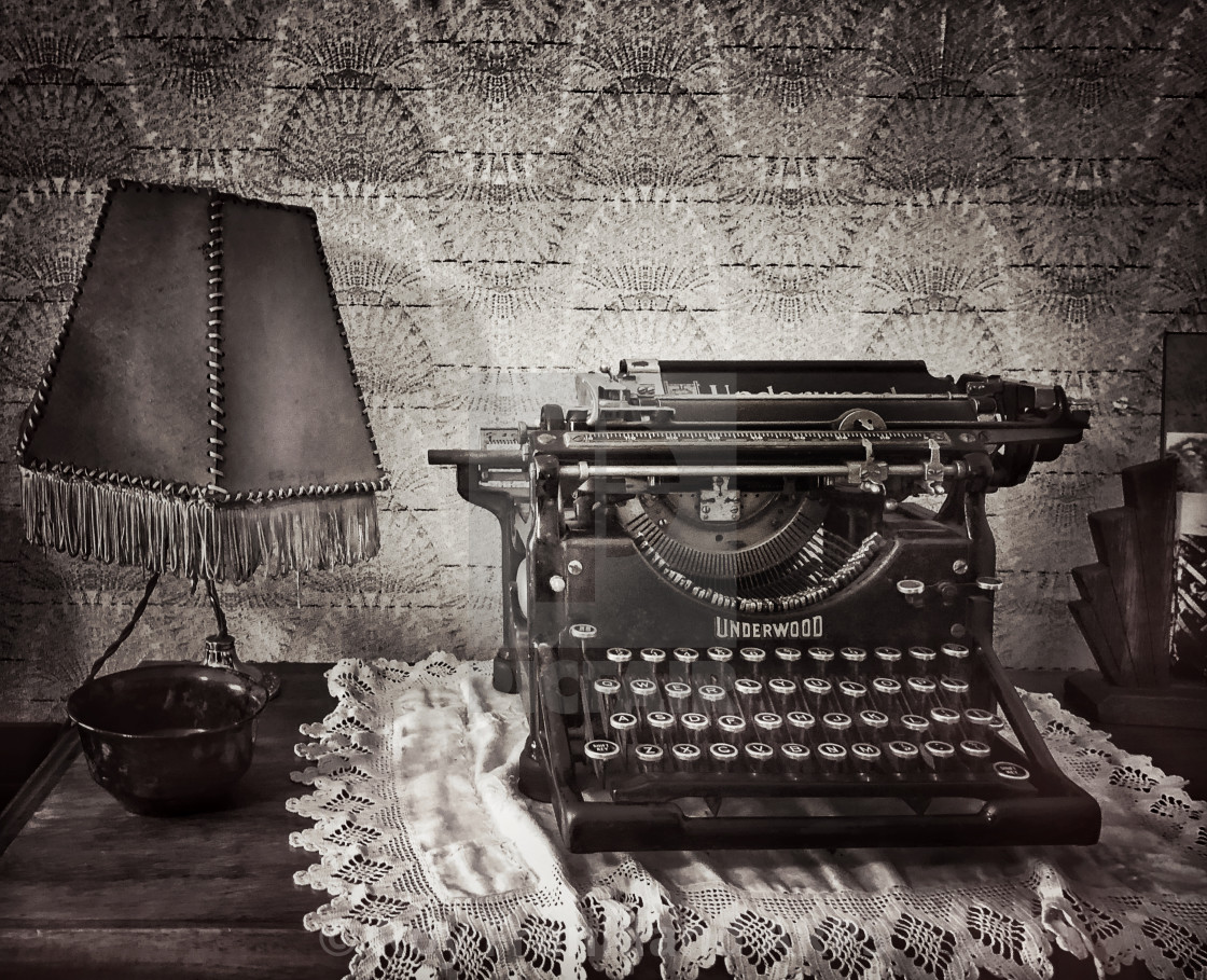 "Underwood typewriter with old lamp, mono" stock image