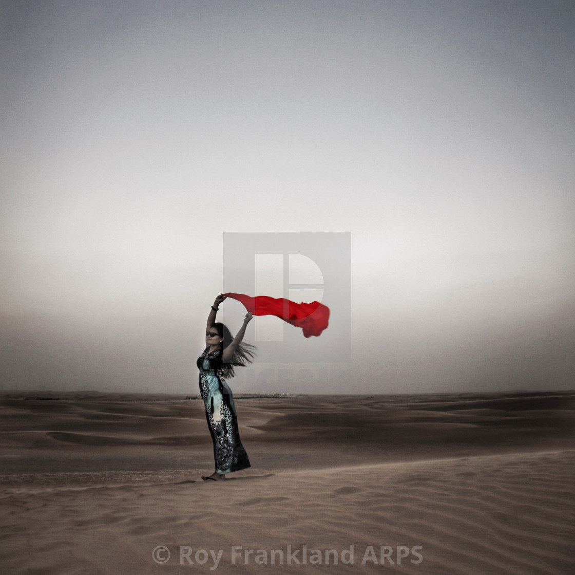 "Woman with a red scarf in the desert 2" stock image