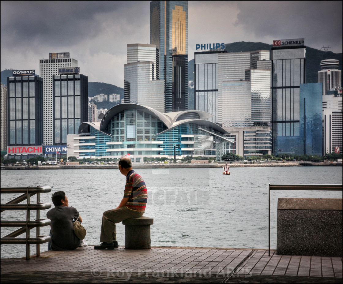 "Guys resting, Hong Kong harbour" stock image