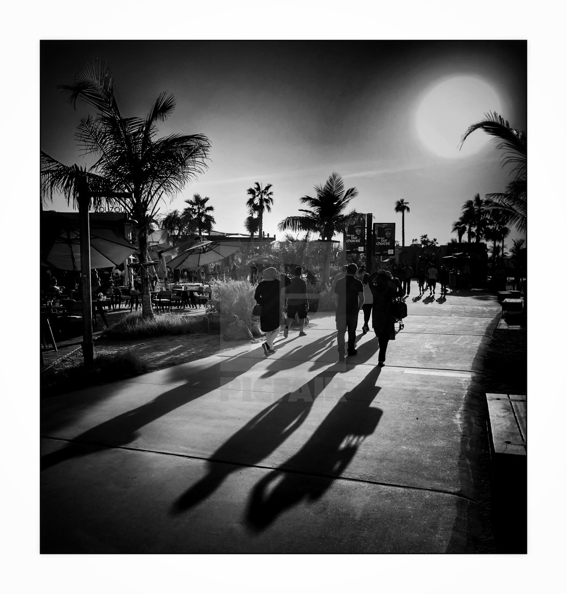 "Long shadows of people, mono" stock image