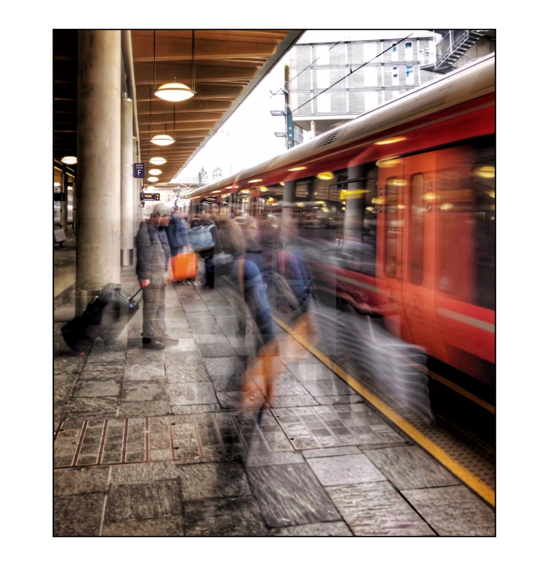 "Train station platform, with moving people" stock image