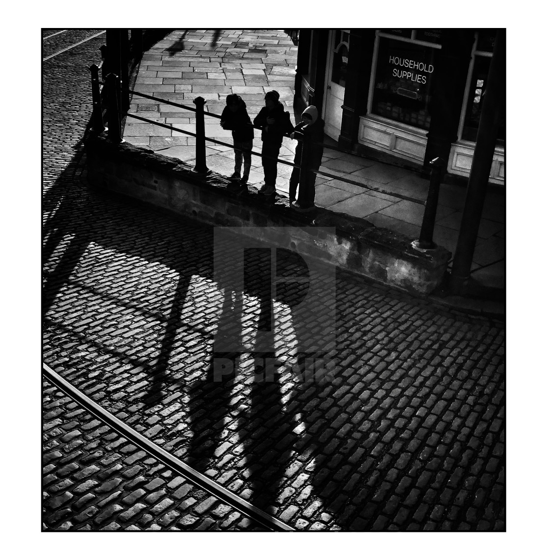 "Long shadows and cobblestones" stock image