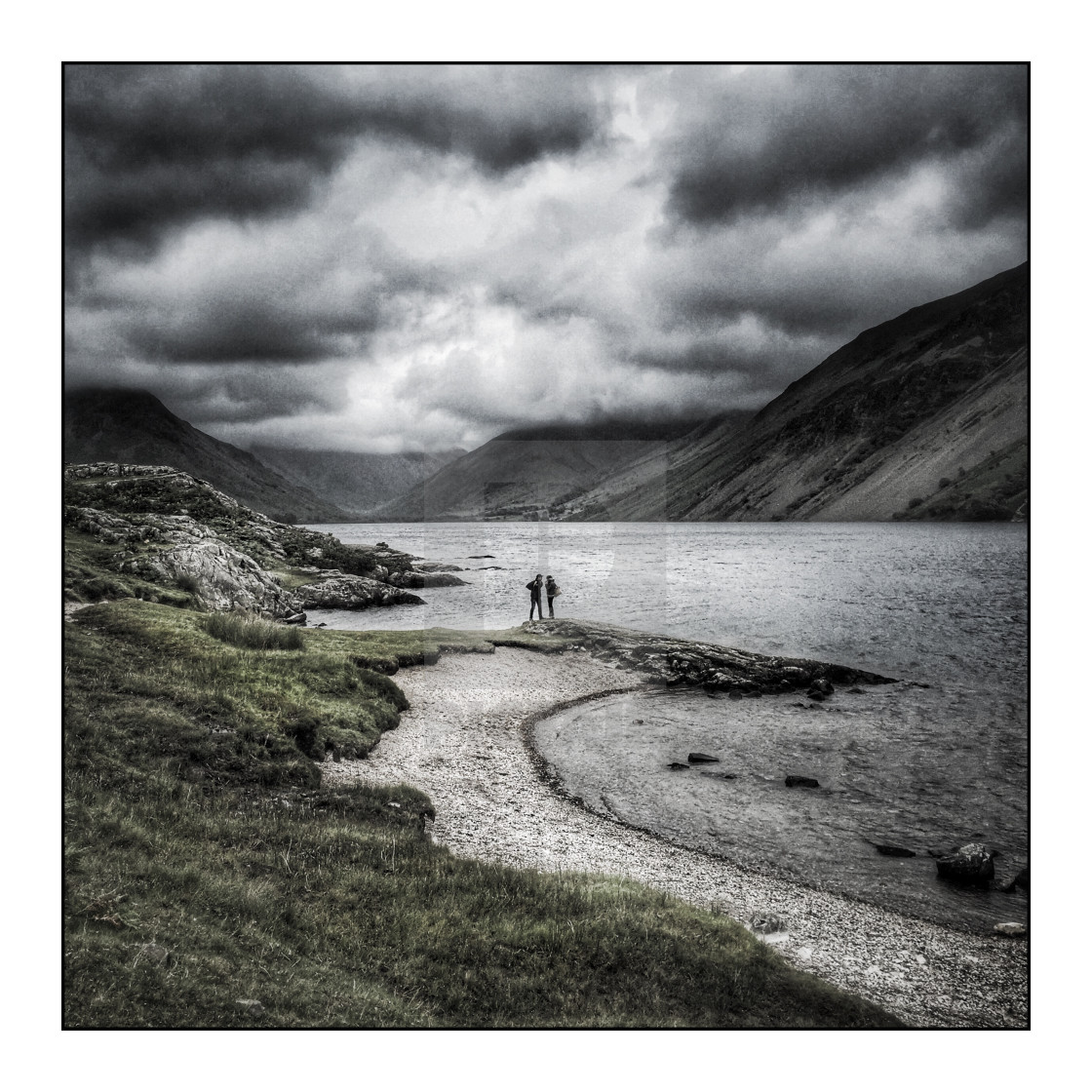 "People at Wastwater lake with storm clouds, selectively coloured" stock image