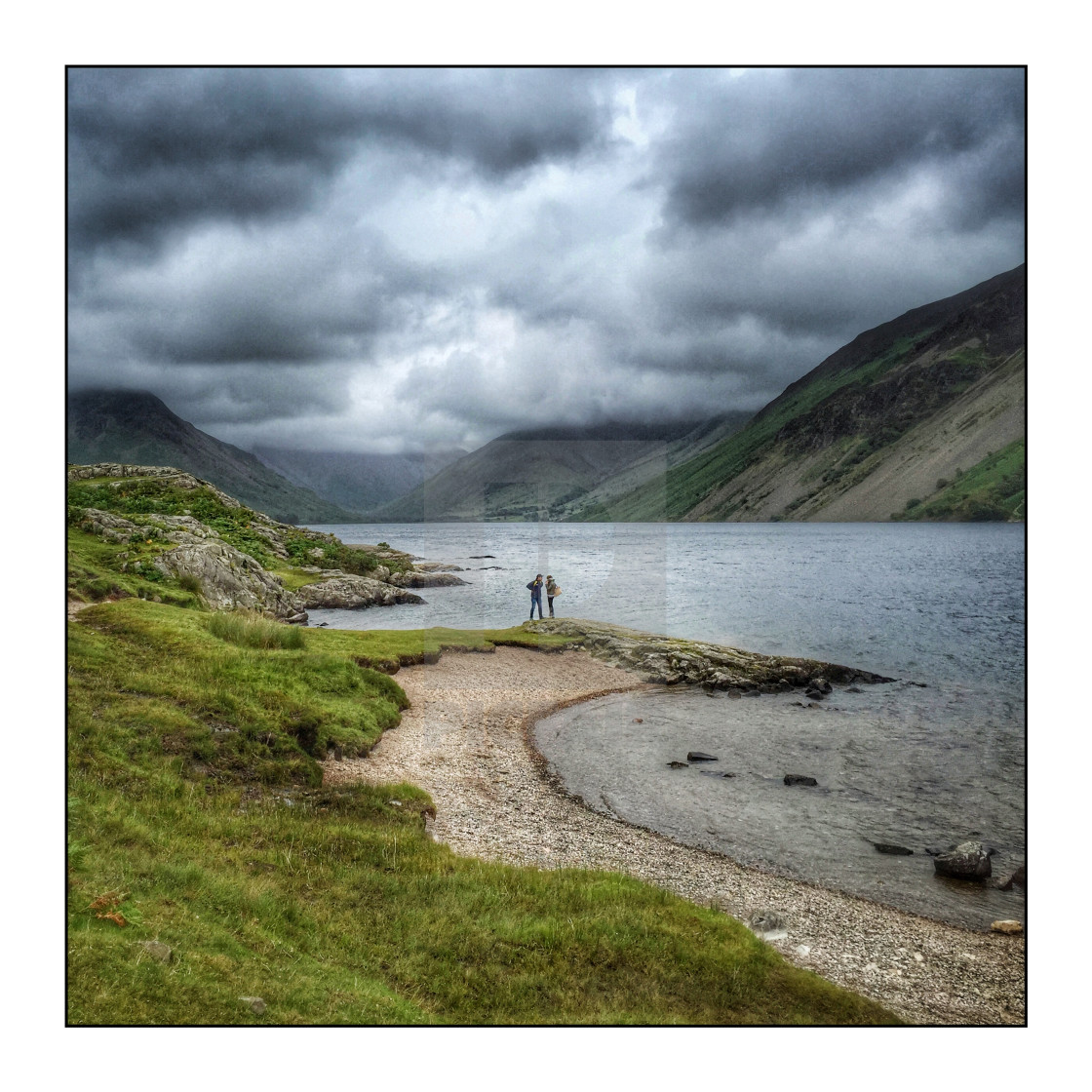 "People at Wastwater lake with storm clouds" stock image