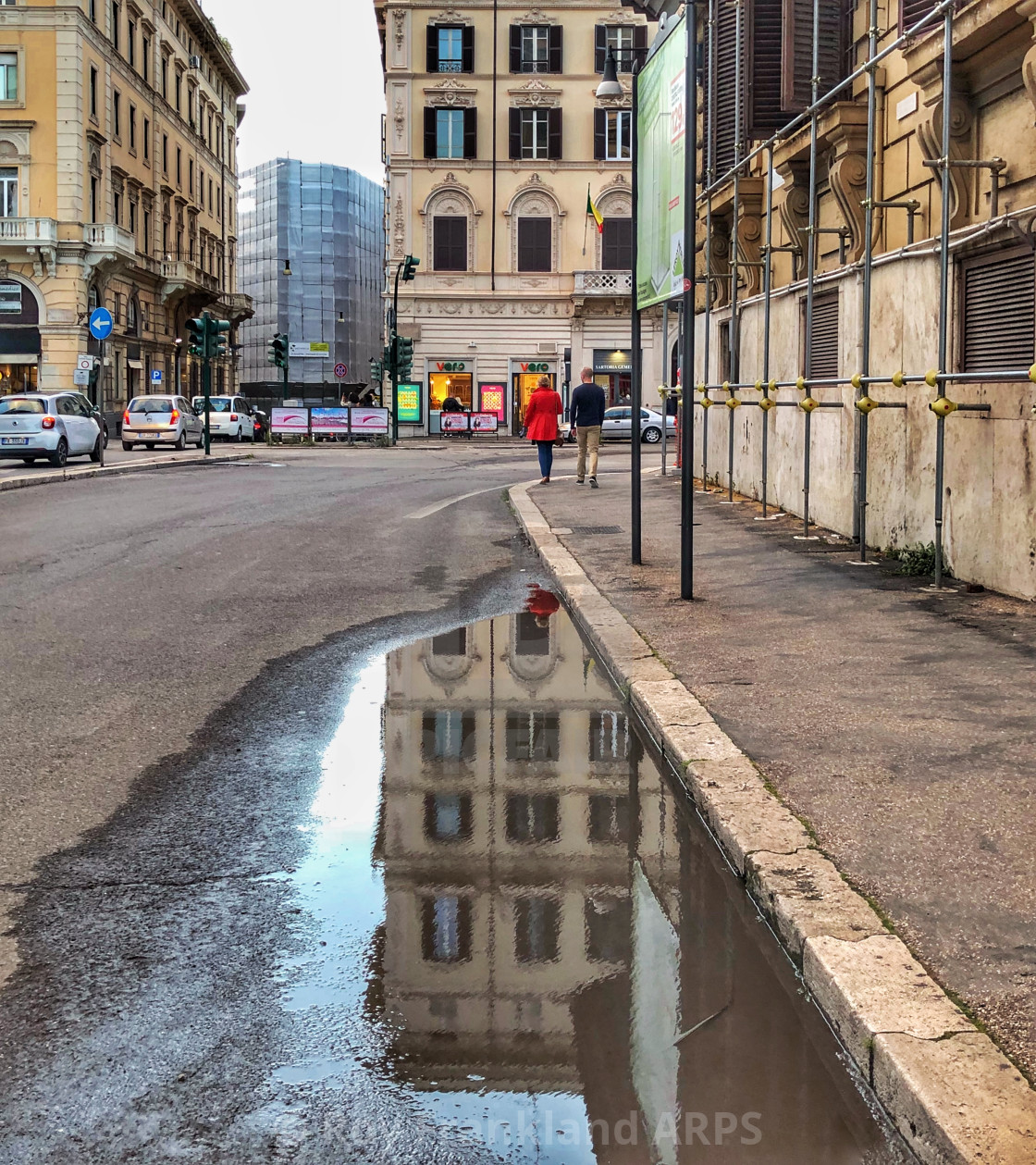 "Red coat in Rome with reflection" stock image