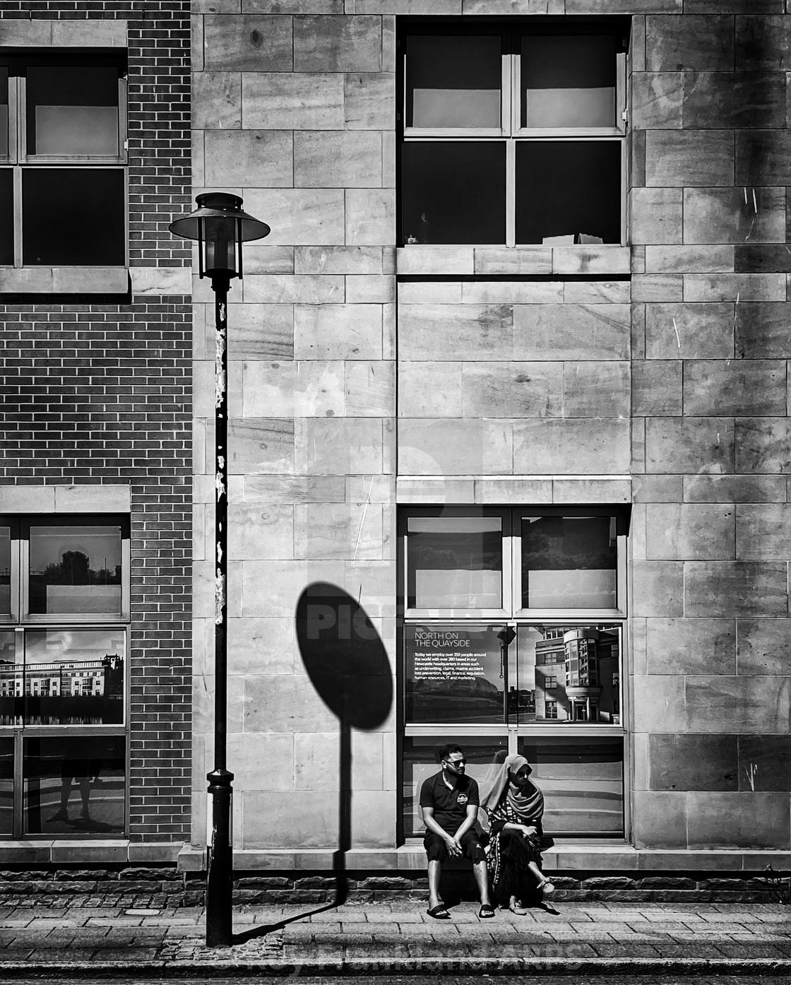 "Sitting couple, mono" stock image