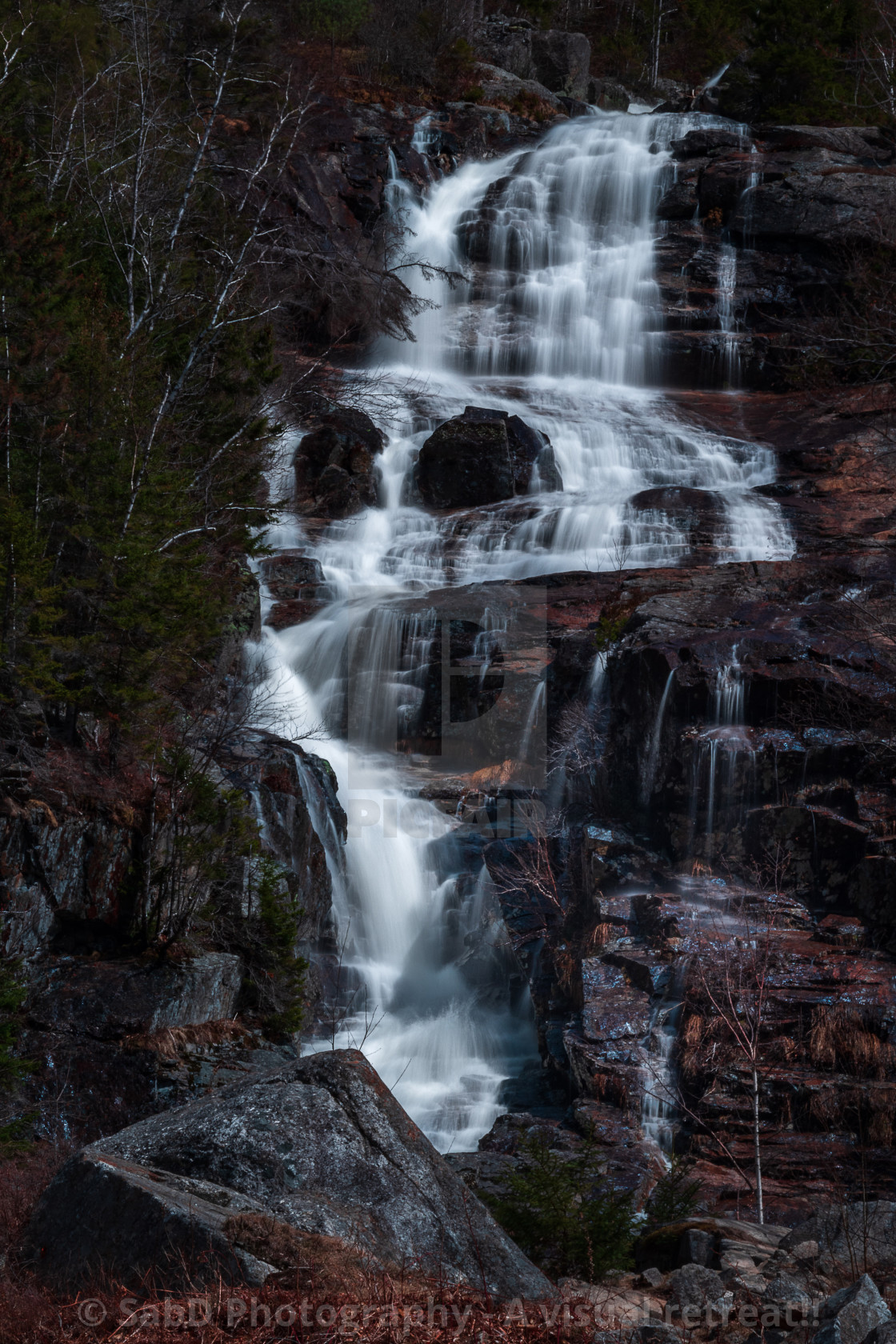 "Cascading water falls in the forest" stock image