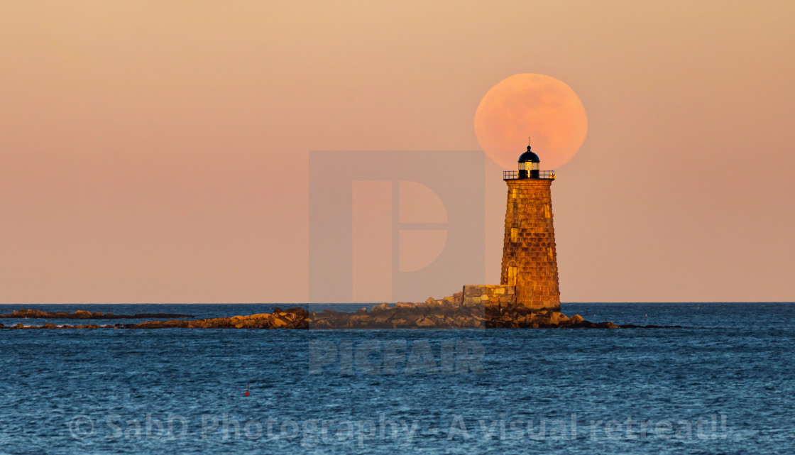 "Perfect Full moon rise over lighthouse on a ocean" stock image