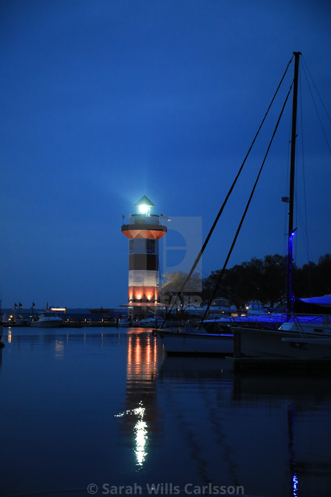 "Hilton Head Harbor Lighthouse at Dusk" stock image