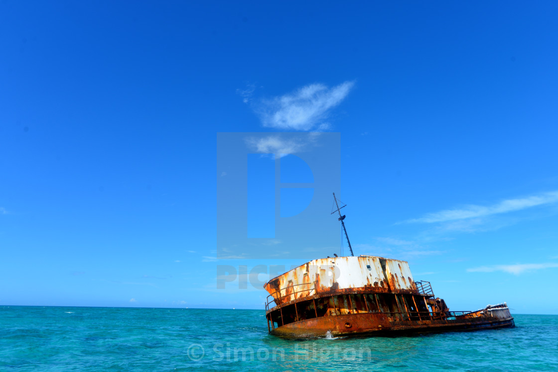 "Old shipwreck in the blue" by Simon Higton - £37.20 "Old shipwreck in the blue" stock image
