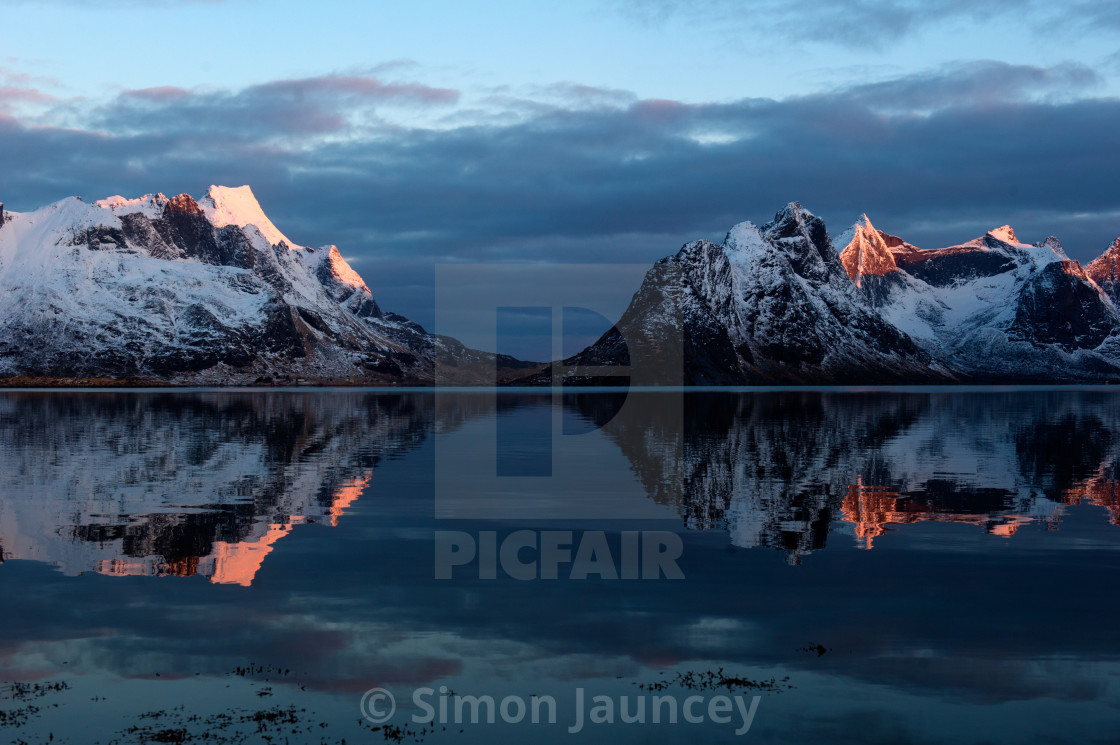 "Sunrise on snowy peaks." stock image