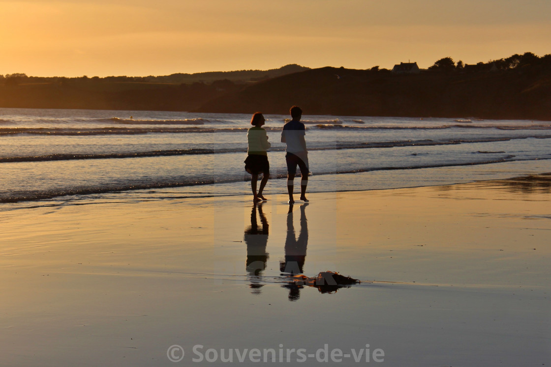 "Stroll along the beach just before bedtime" stock image