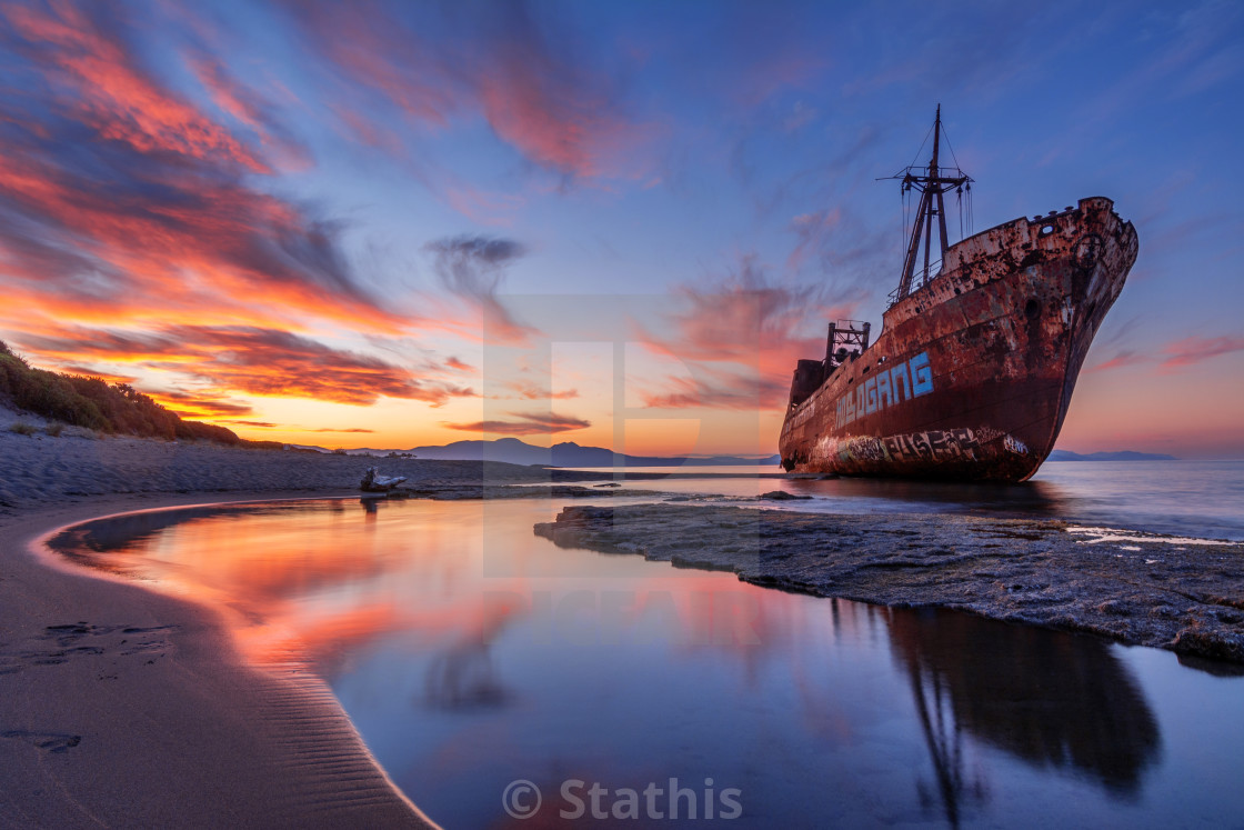 "Old ship in sunrise." stock image