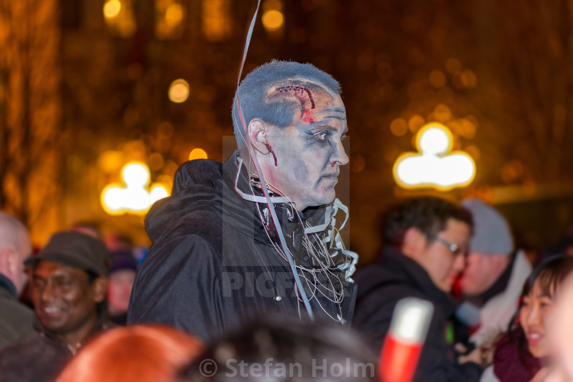 "Man in zombie look scaring people at Halloween parade Shockholm" by Stefan Holm - $6.31 "Man in zombie look scaring people at Halloween parade Shockholm" stock image