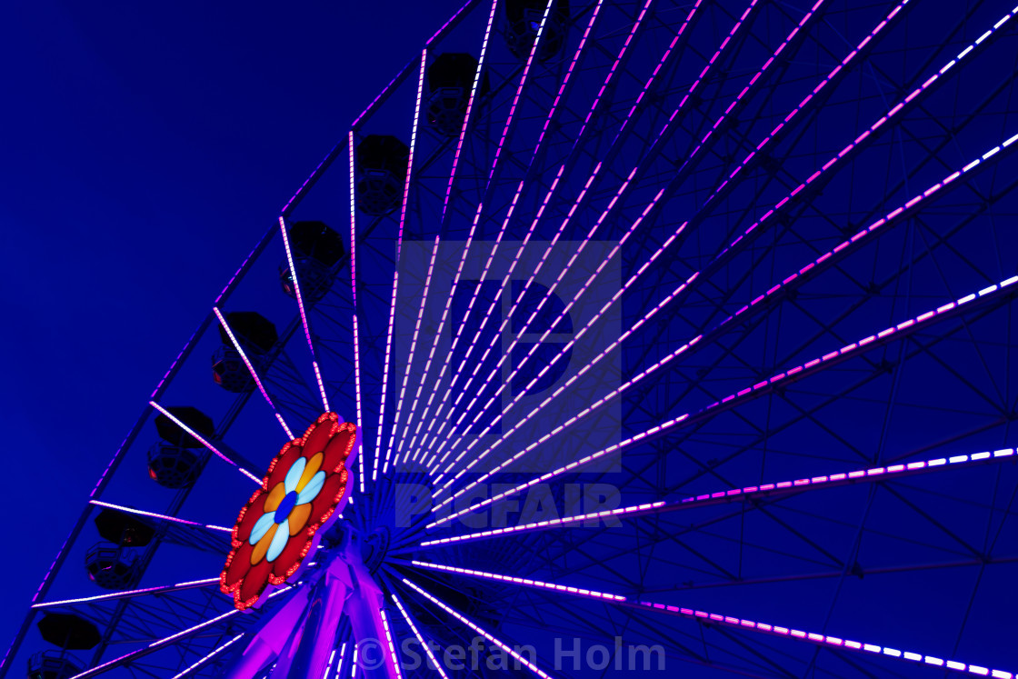 "Colorful ferriswheel in vivid neon colors and a dark blue sky" by Stefan Holm - $6.32 "Colorful ferriswheel in vivid neon colors and a dark blue sky" stock image