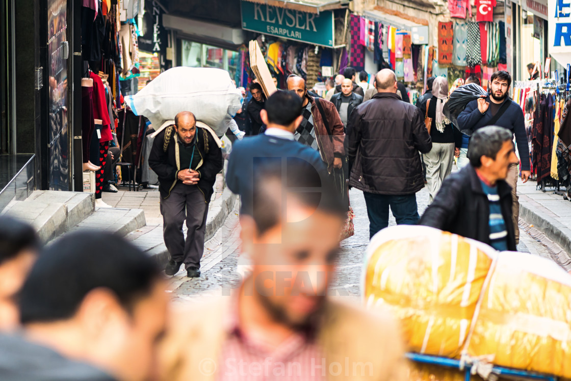 "ISTANBUL - NOV, 20: Delivery man carrying goods on the way to th" by Stefan Holm - $6.32 "ISTANBUL - NOV, 20: Delivery man carrying goods on the way to th" stock image