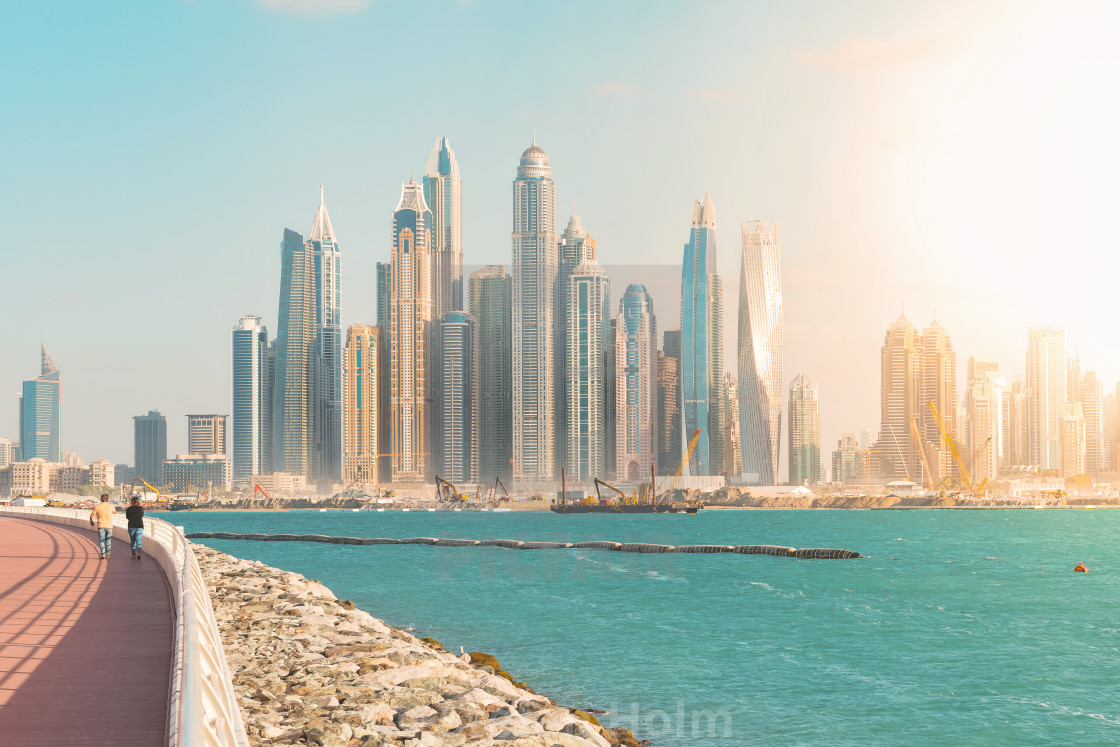 "Walkway at the palm with view over the Dubai marina district dur" by Stefan Holm - $6.32 "Walkway at the palm with view over the Dubai marina district dur" stock image